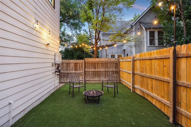 2102 Eva St Unit 2, Austin, TX 78704 - fenced backyard featuring an outdoor fire pit