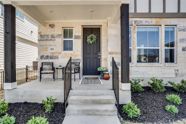 970 Lone Peak Way, Dripping Springs, TX 78620 - view of exterior entry with covered porch and stone siding