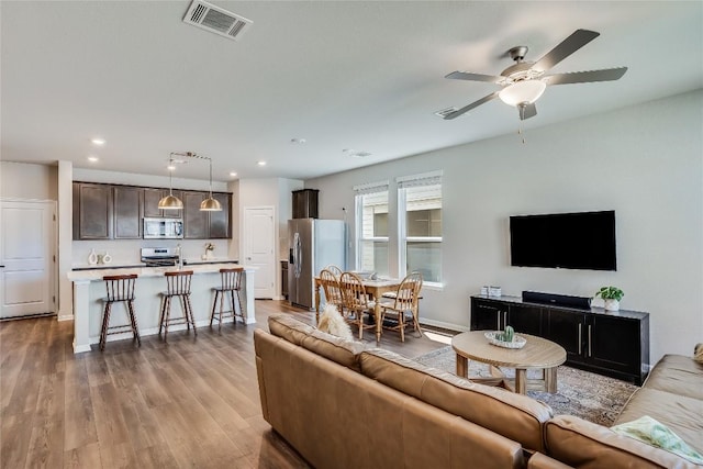 970 Lone Peak Way, Dripping Springs, TX 78620 - living room with wood finished floors, ceiling fan, and recessed lighting