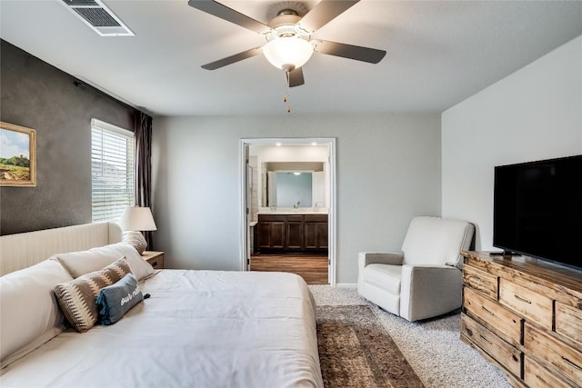 970 Lone Peak Way, Dripping Springs, TX 78620 - carpeted bedroom with ensuite bath and a ceiling fan