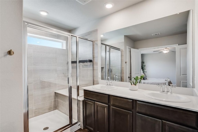 970 Lone Peak Way, Dripping Springs, TX 78620 - bathroom featuring a shower stall, double vanity, a ceiling fan, and ensuite bathroom