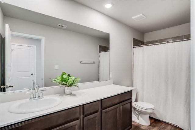 970 Lone Peak Way, Dripping Springs, TX 78620 - bathroom featuring vanity, toilet, wood finished floors, curtained shower, and recessed lighting