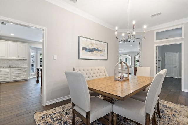 dining area featuring visible vents, a notable chandelier, ornamental molding, and a healthy amount of sunlight