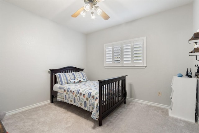 bedroom featuring baseboards, a ceiling fan, and carpet flooring