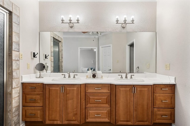 bathroom with a ceiling fan, a sink, and double vanity