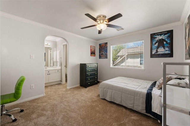 1406 Hunter Ace Way, Cedar Park, TX 78613 - bedroom with light carpet, ornamental molding, arched walkways, baseboards, and ensuite bathroom