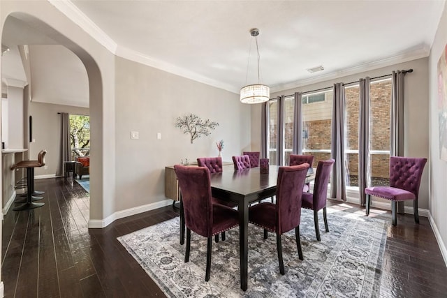 1406 Hunter Ace Way, Cedar Park, TX 78613 - dining space featuring arched walkways, baseboards, dark wood finished floors, and ornamental molding