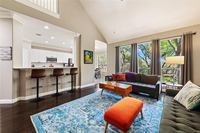 1406 Hunter Ace Way, Cedar Park, TX 78613 - living area featuring dark wood-style floors, baseboards, recessed lighting, and high vaulted ceiling
