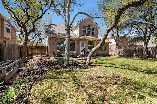 1406 Hunter Ace Way, Cedar Park, TX 78613 - rear view of house with brick siding, a patio area, and a chimney