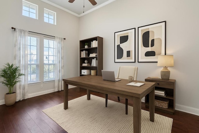 3501 Venezia Vw, Leander, TX 78641 - home office with a ceiling fan, ornamental molding, dark wood finished floors, and a towering ceiling
