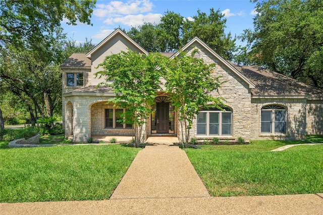 2928 Chatelaine Dr, Austin, TX 78746 - view of front of house with stone siding and a front lawn