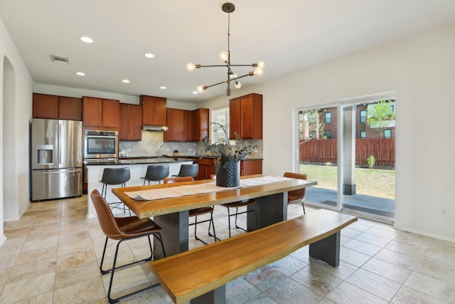 dining area featuring a chandelier, recessed lighting, visible vents, and baseboards