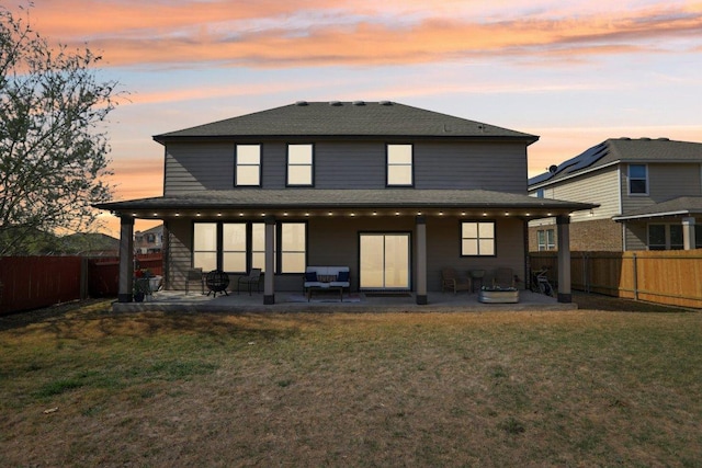1318 Autumn Sage Way, Pflugerville, TX 78660 - back of house at dusk with a patio area and a shingled roof