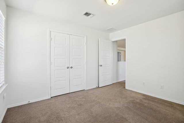 1318 Autumn Sage Way, Pflugerville, TX 78660 - unfurnished bedroom with carpet, a closet, and baseboards
