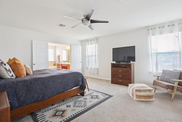 1318 Autumn Sage Way, Pflugerville, TX 78660 - carpeted bedroom featuring ceiling fan and ensuite bathroom
