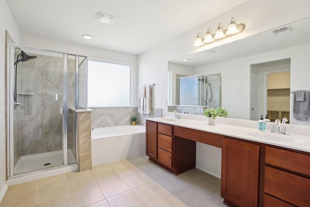 1318 Autumn Sage Way, Pflugerville, TX 78660 - full bathroom featuring double vanity, a garden tub, a shower stall, tile patterned flooring, and recessed lighting