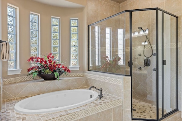 2116 University Club Dr, Austin, TX 78732 - bathroom with a bath, a shower stall, and plenty of natural light