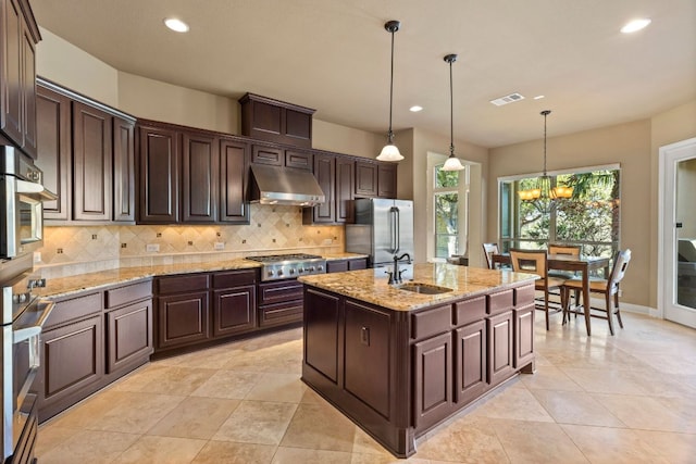 2116 University Club Dr, Austin, TX 78732 - kitchen featuring stainless steel appliances, under cabinet range hood, a sink, recessed lighting, and backsplash