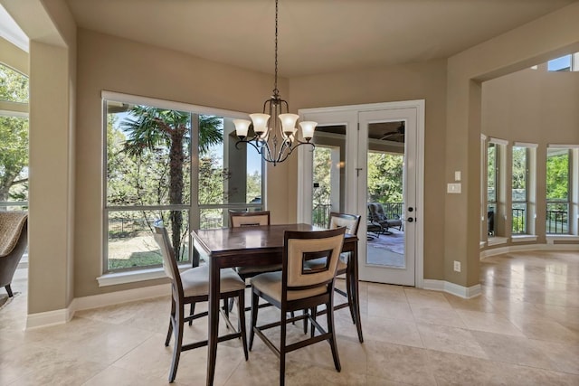 2116 University Club Dr, Austin, TX 78732 - dining room with a chandelier, plenty of natural light, and light tile patterned floors