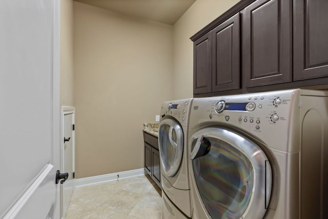 2116 University Club Dr, Austin, TX 78732 - washroom featuring separate washer and dryer, cabinet space, and baseboards