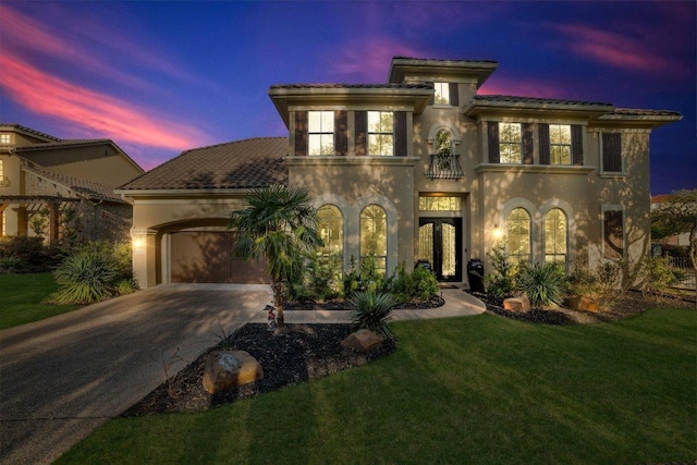 2116 University Club Dr, Austin, TX 78732 - mediterranean / spanish home with french doors, stucco siding, a tile roof, and driveway