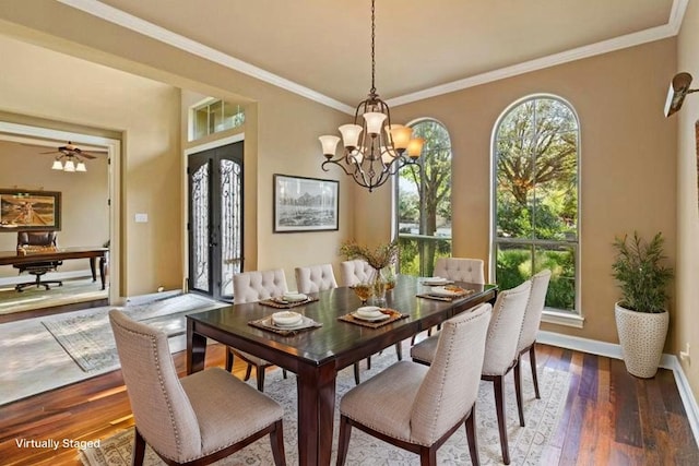 2116 University Club Dr, Austin, TX 78732 - dining room featuring a chandelier, wood finished floors, ornamental molding, and baseboards