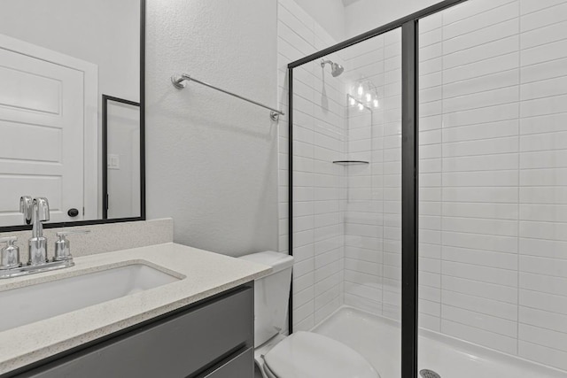 7804 Alouette Dr, Austin, TX 78738 - bathroom with a shower stall, vanity, toilet, and a textured wall