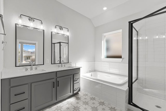 7804 Alouette Dr, Austin, TX 78738 - bathroom with a shower stall, a bath, double vanity, lofted ceiling, and tile patterned floors