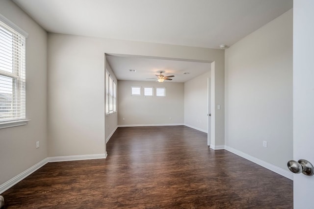 8017 Turnberry Ln, Austin, TX 78744 - unfurnished room featuring ceiling fan, dark wood-style flooring, and baseboards