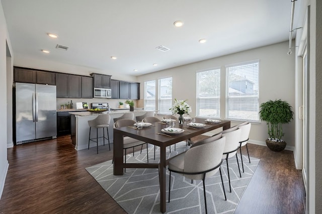 8017 Turnberry Ln, Austin, TX 78744 - dining room featuring recessed lighting, dark wood-type flooring, and baseboards
