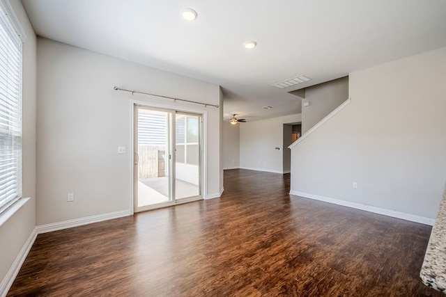 8017 Turnberry Ln, Austin, TX 78744 - spare room featuring healthy amount of natural light, dark wood-style floors, baseboards, and recessed lighting