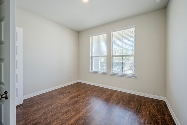 8017 Turnberry Ln, Austin, TX 78744 - spare room with dark wood-type flooring and baseboards