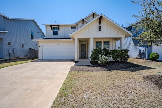 8017 Turnberry Ln, Austin, TX 78744 - view of front of house featuring board and batten siding, driveway, an attached garage, and a porch