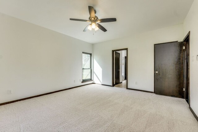 30809 Berry Creek Dr, Georgetown, TX 78628 - unfurnished bedroom with carpet flooring, baseboards, and a ceiling fan