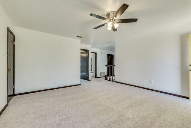 30809 Berry Creek Dr, Georgetown, TX 78628 - unfurnished room featuring light carpet, ceiling fan, and baseboards