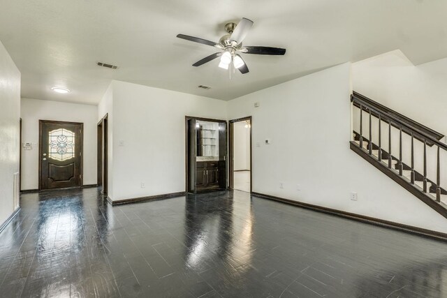 30809 Berry Creek Dr, Georgetown, TX 78628 - unfurnished living room with a ceiling fan, wood finished floors, baseboards, and stairway