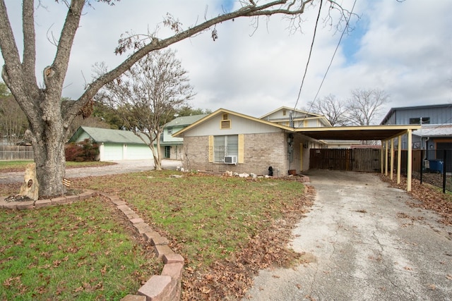 1683 Kuehler Ave, New Braunfels, TX 78130 - view of front of property with asphalt driveway, brick siding, a carport, and cooling unit