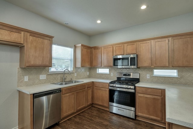 1225 Cardigan St, Cedar Park, TX 78613 - kitchen featuring stainless steel appliances, a sink, dark wood-style flooring, light countertops, and recessed lighting