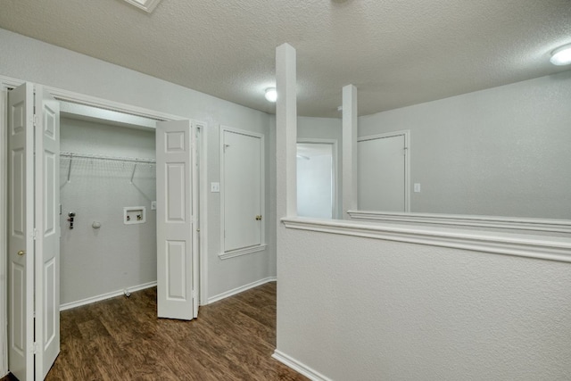 1225 Cardigan St, Cedar Park, TX 78613 - laundry room featuring washer hookup, wood finished floors, a textured ceiling, and baseboards