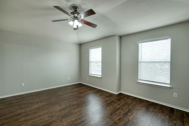 1225 Cardigan St, Cedar Park, TX 78613 - unfurnished room featuring dark wood-style floors, a ceiling fan, baseboards, and a textured ceiling