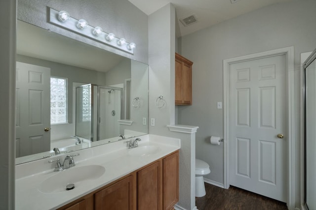 1225 Cardigan St, Cedar Park, TX 78613 - bathroom with a shower stall, double vanity, wood finished floors, a garden tub, and toilet