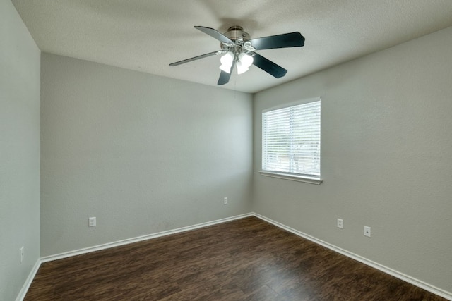 1225 Cardigan St, Cedar Park, TX 78613 - spare room featuring dark wood-style flooring, a ceiling fan, and baseboards