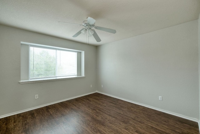 1225 Cardigan St, Cedar Park, TX 78613 - unfurnished room with dark wood-style floors, a ceiling fan, and baseboards