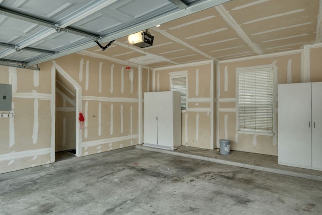 1225 Cardigan St, Cedar Park, TX 78613 - garage featuring a garage door opener and electric panel