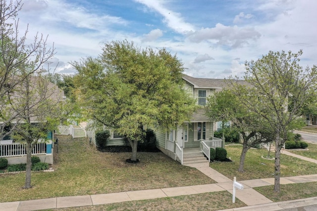 1225 Cardigan St, Cedar Park, TX 78613 - view of property hidden behind natural elements with covered porch and a front lawn