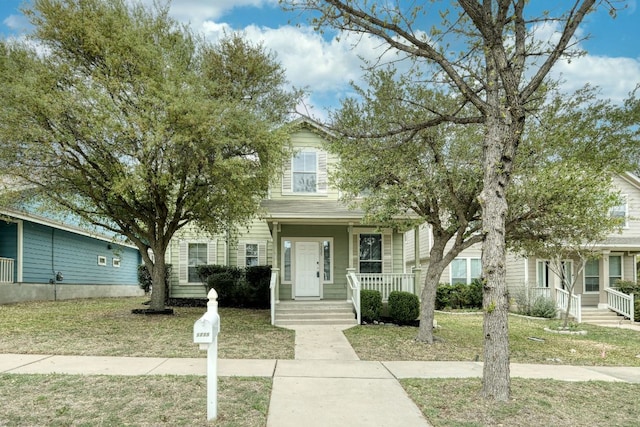 1225 Cardigan St, Cedar Park, TX 78613 - view of property hidden behind natural elements with covered porch and a front lawn