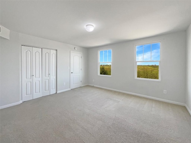 1705 Arbor Knot Dr, Kyle, TX 78640 - unfurnished bedroom with baseboards and carpet flooring