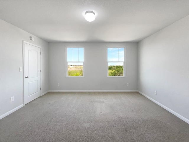 1705 Arbor Knot Dr, Kyle, TX 78640 - carpeted empty room featuring baseboards