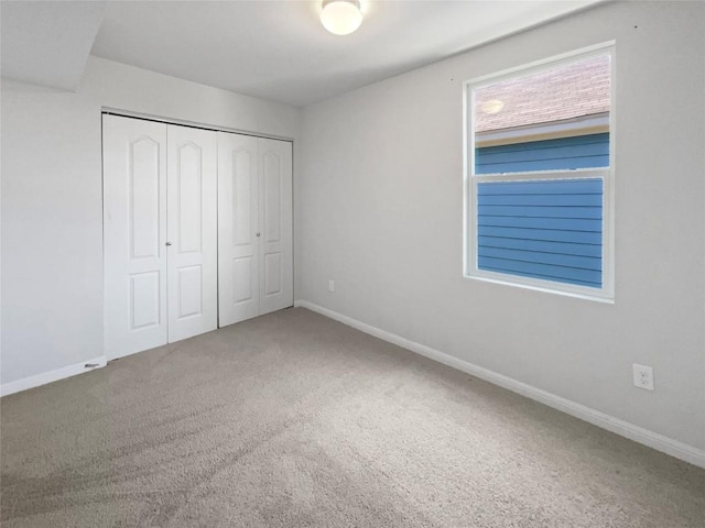 1705 Arbor Knot Dr, Kyle, TX 78640 - unfurnished bedroom with carpet flooring and a closet