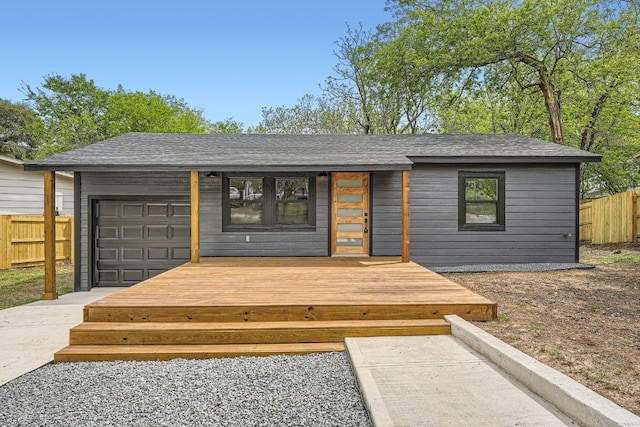 1601 N Redondo Dr, Austin, TX 78721 - wooden deck with a garage and concrete driveway